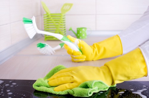 Cleaners applying safe practices during a carpet cleaning job
