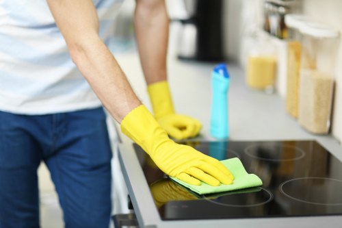 Experienced TW13 carpet cleaner preparing a room for treatment