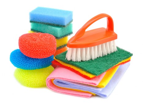 Technician using professional carpet cleaning equipment indoors